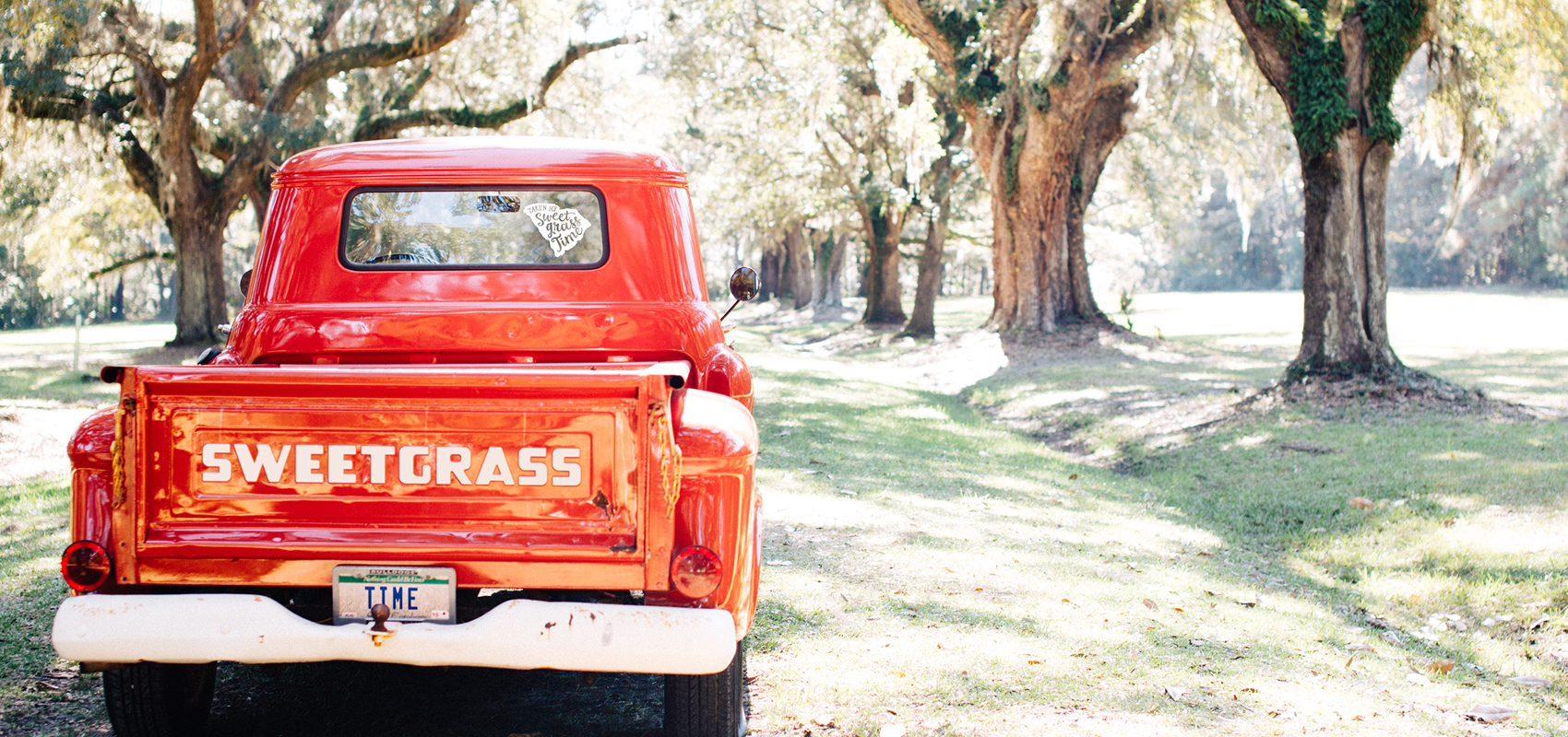 1950s Red Chevy Pickup with Sweetgrass Time on the tailgate and license plate